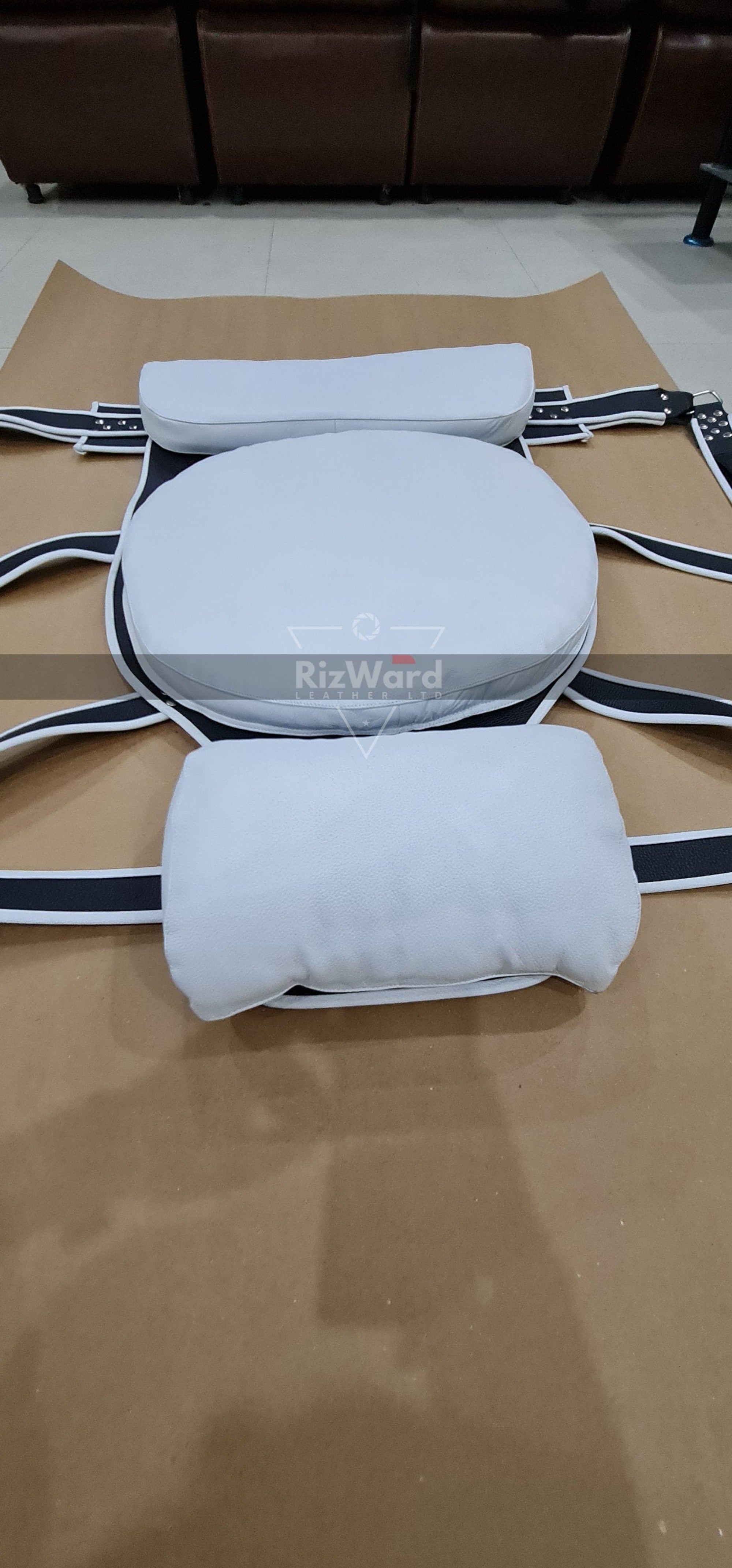 back view of VIP white leather sex swing laying on ground